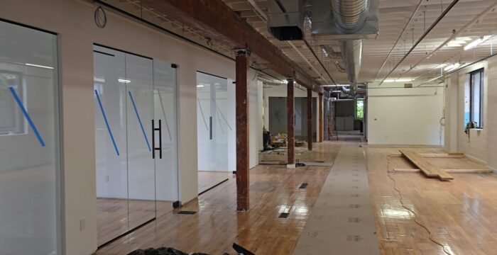 02_HOME_Commercial_Office_Glass_Hallway_Near-Finish